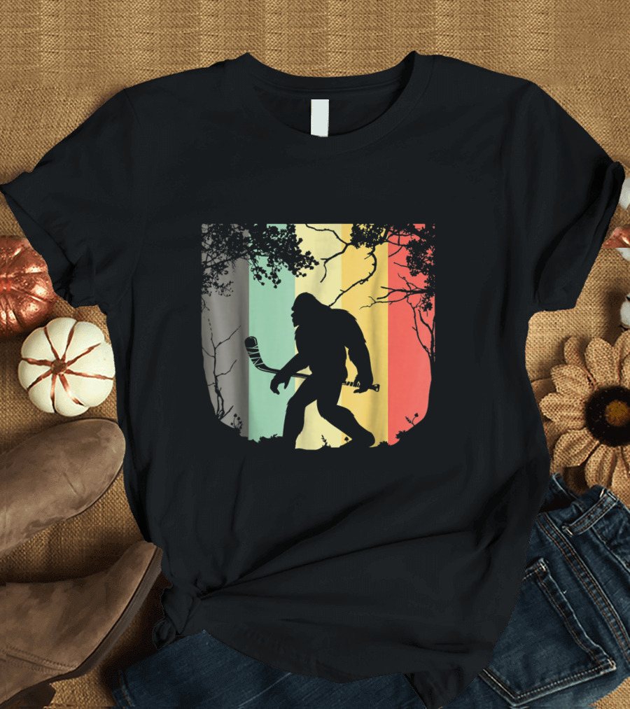 Vintage Bigfoot Hockey Silhouette with Retro Stripes in Forest Setting T-Shirt