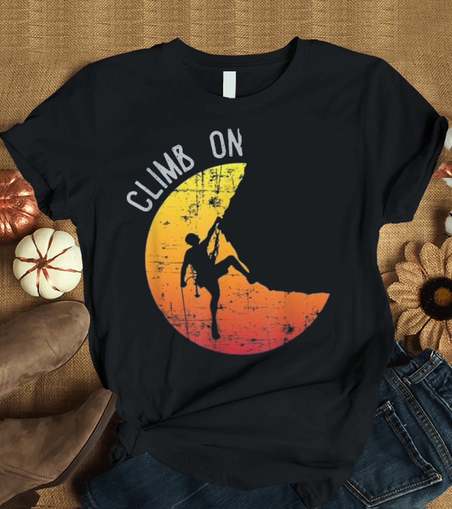 Climb On Rock Mountain Climbing Silhouette against Distressed Yellow and Orange Suns Background T-Shirt