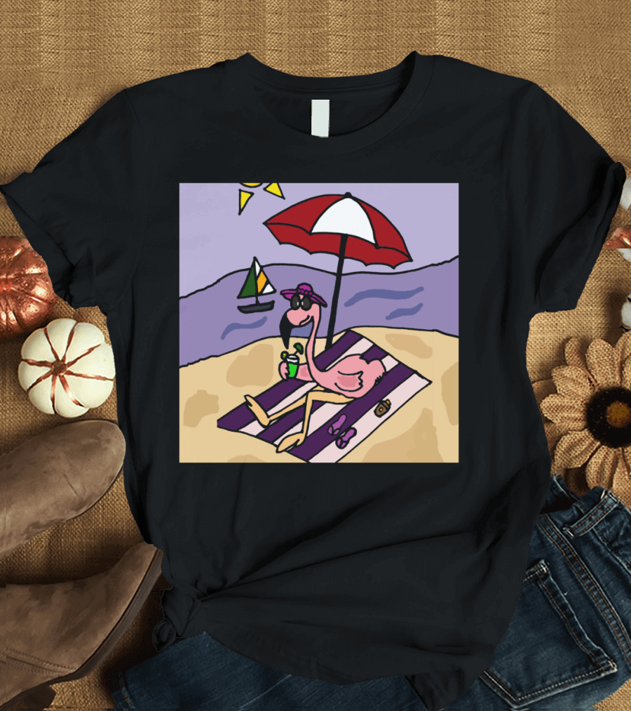 Funny Pink Flamingo Relaxing Under Umbrella at Beach with Sailboat T-Shirt