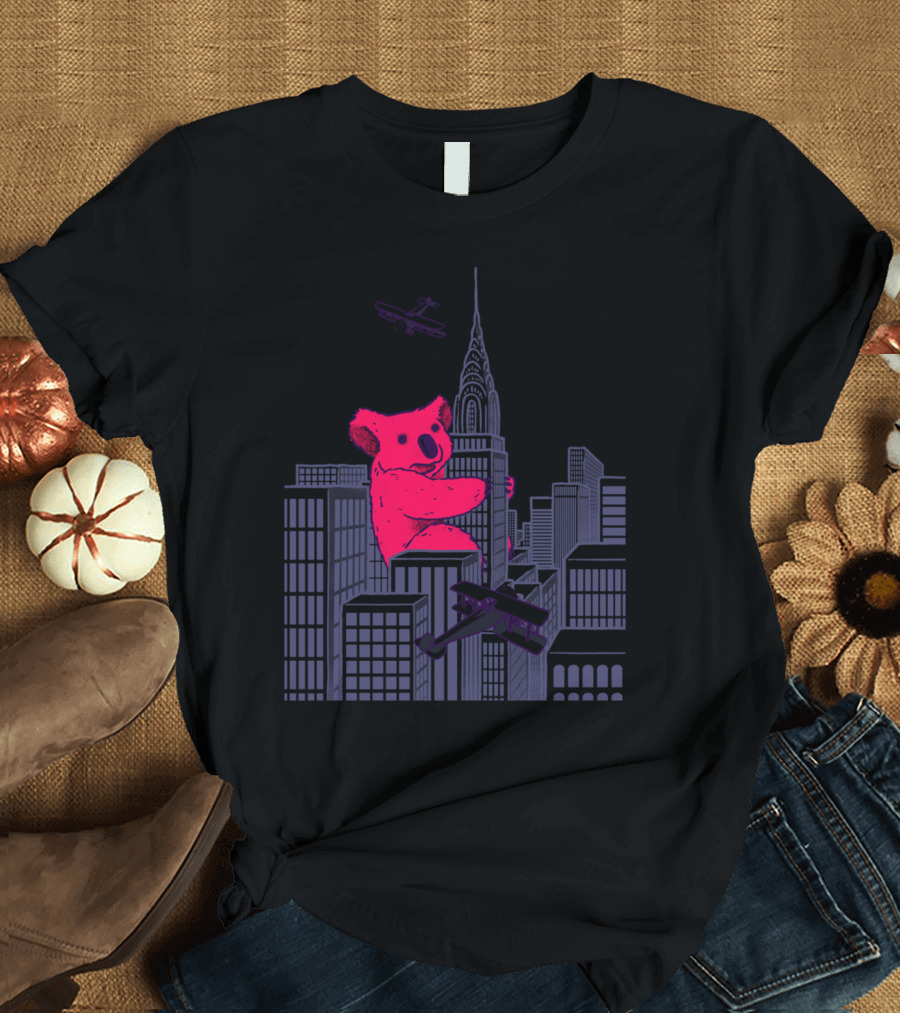Giant Pink Koala Climbs Skyscrapers with Biplanes in Marsupial Madness T-Shirt