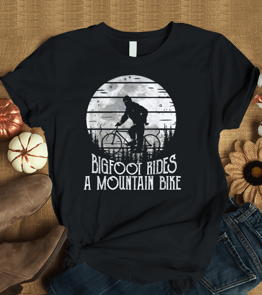 Bigfoot Rides A Mountain Bike Silhouette Against Moonlit Forest T-Shirt