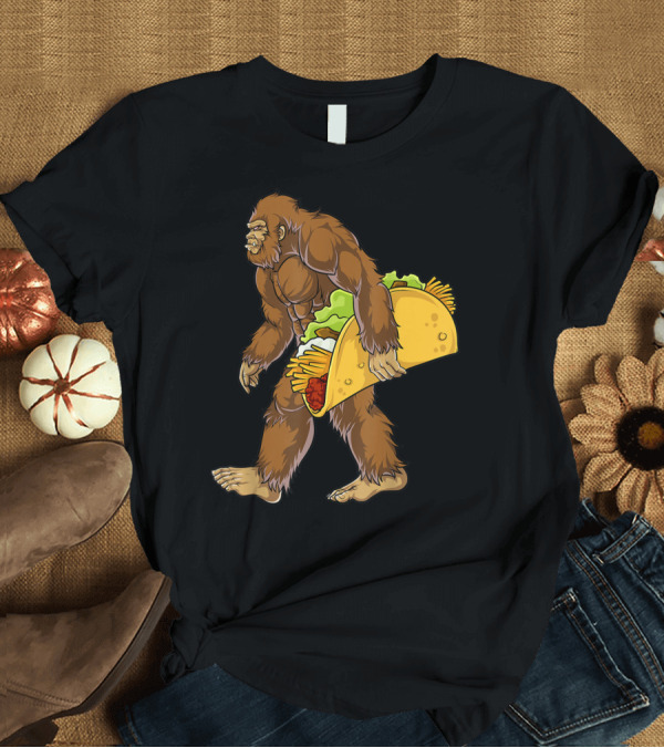 T-Shirt: Bigfoot Carrying Taco Cinco De Mayo Novelty T-Shirt Bigfoot Carrying Taco Cinco De Mayo Novelty T-Shirt