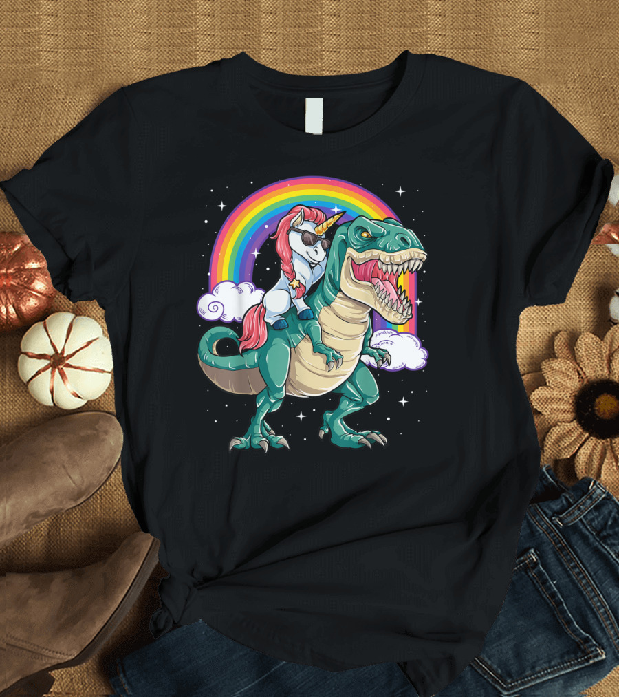 Unicorn with Sunglasses Riding T-Rex Dinosaur under Rainbow with Clouds T-Shirt