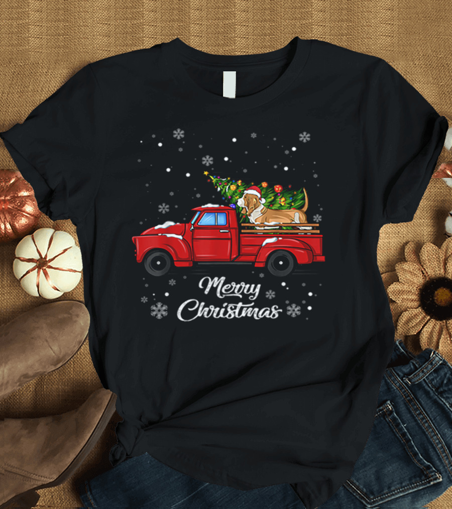 Merry Christmas Basset Hound with Santa Hat on Red Truck with Christmas Tree and Snowflakes T-Shirt