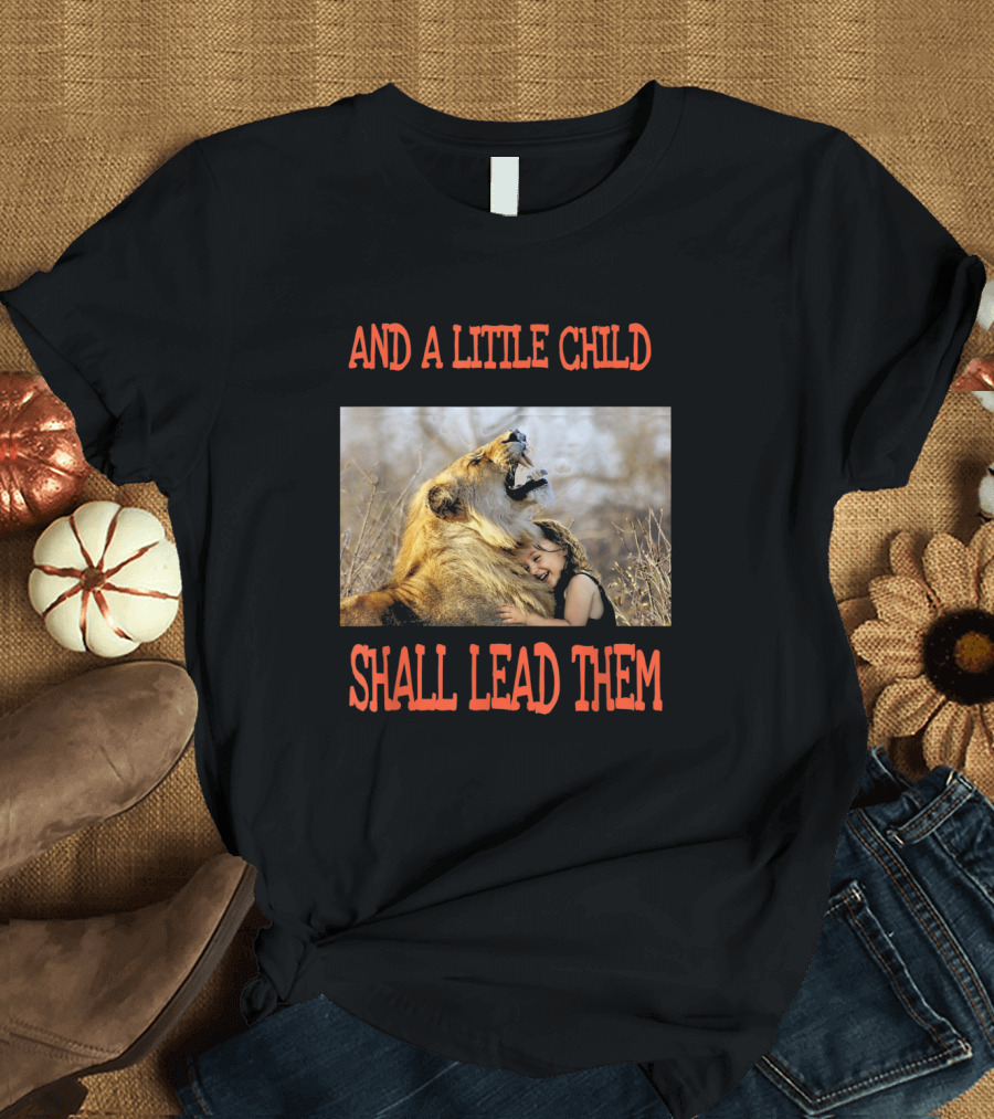 AND A LITTLE CHILD SHALL LEAD THEM Hugging A Lion In A Field T-Shirt