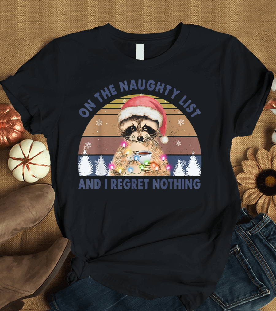 On The Naughty List And I Regret Nothing Raccoon Santa Hat Holding Coffee Christmas Lights Snowflakes Forest T-Shirt