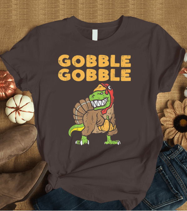 T-Shirt: Gobble Gobble T-Rex Dinosaur Turkey Holding Pumpkin T-Shirt Gobble Gobble T-Rex Dinosaur Turkey Holding Pumpkin T-Shirt