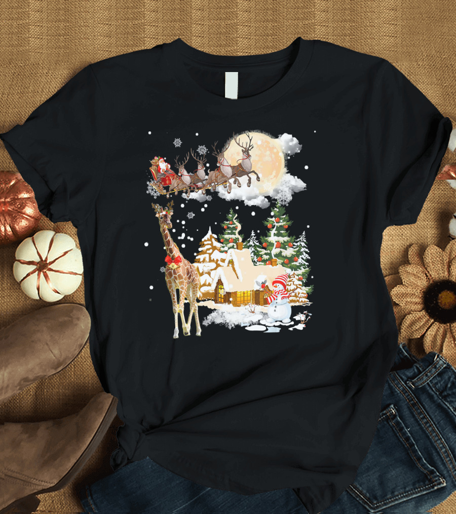 Santa's Sleigh Over Snowy Christmas Village with Giraffe T-Shirt