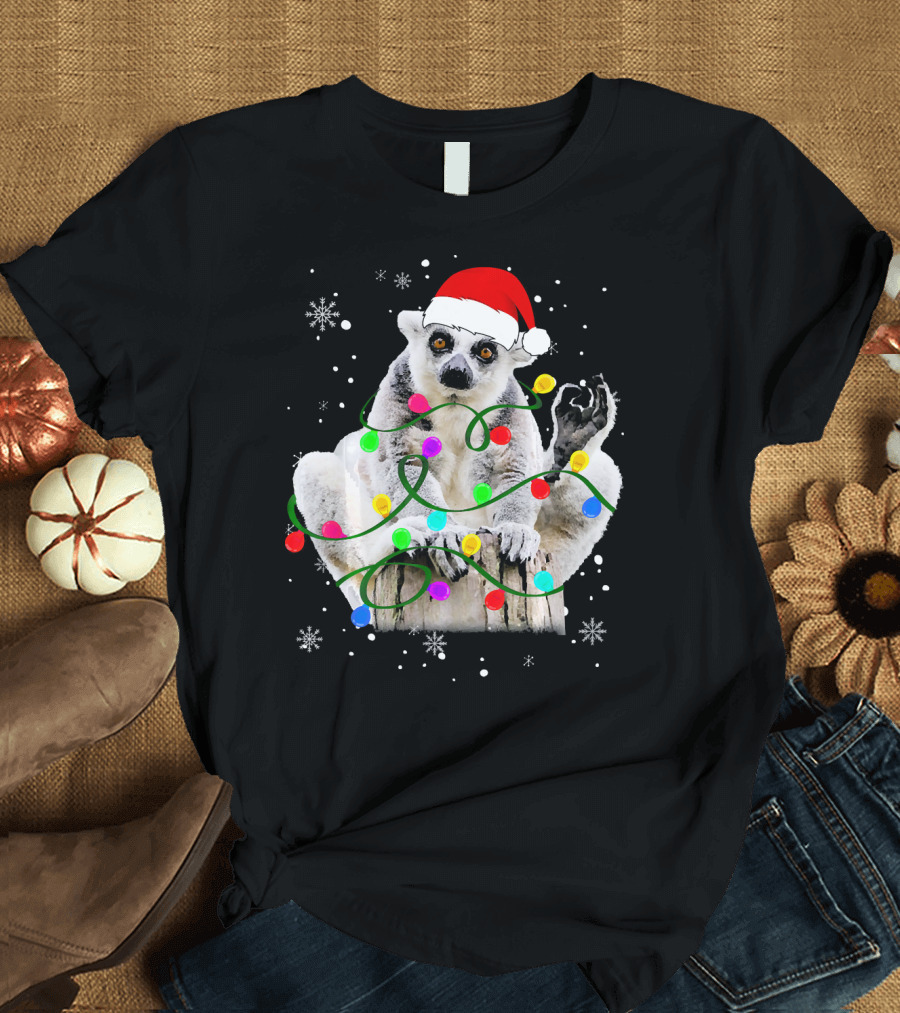 Lemur with Santa Hat and Colorful Christmas Lights Surrounded by Snowflakes T-Shirt