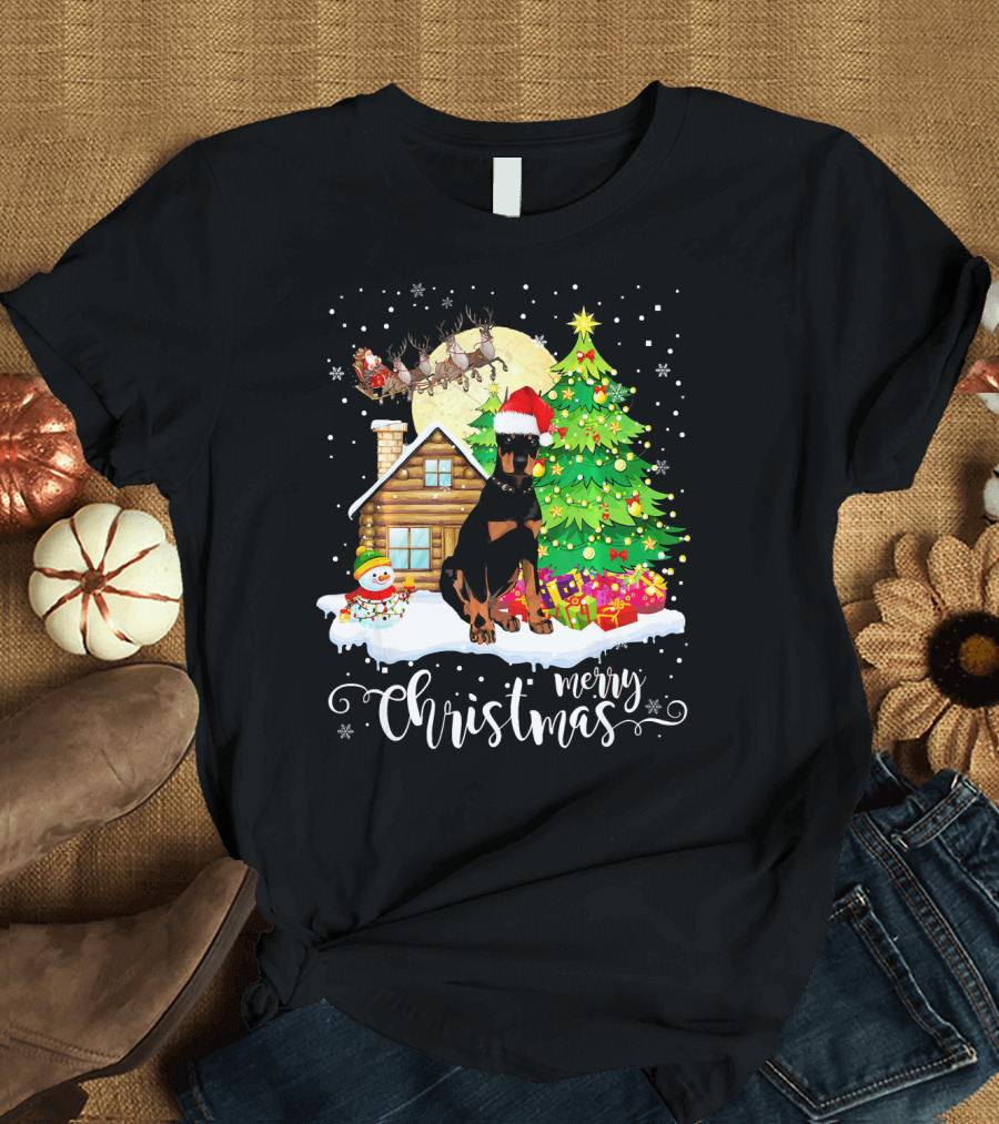 Merry Christmas Doberman with Santa Hat by Christmas Tree and Snowman T-Shirt