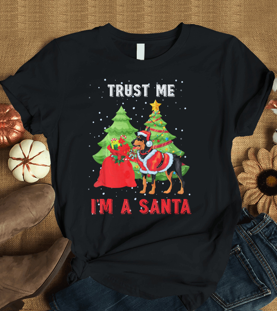 Trust Me I'm a Santa Doberman in Holiday Outfit with Christmas Trees and Red Gift Bag T-Shirt