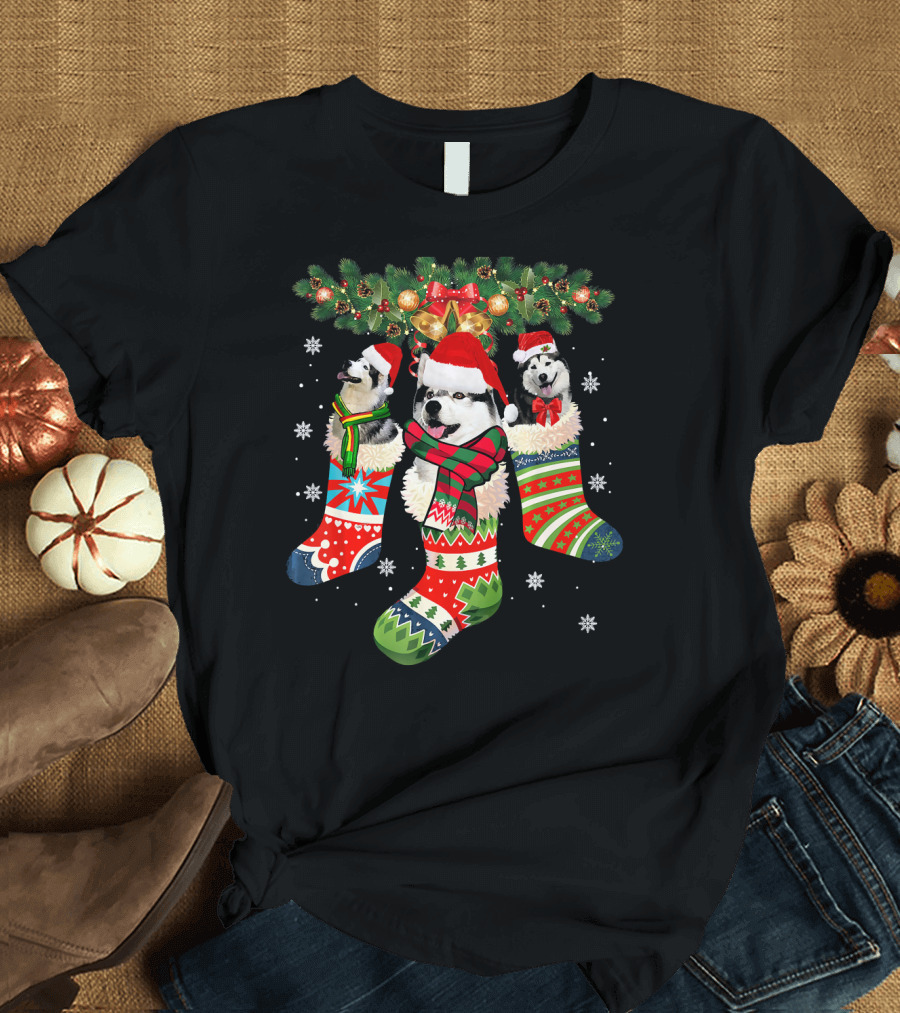 Three Husky Dogs in Colorful Christmas Stockings with Santa Hats and Holiday Garland T-Shirt