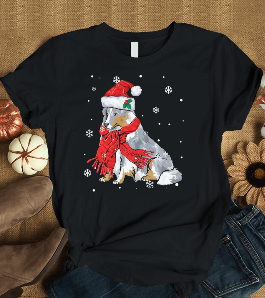 Sheltie with Santa Hat and Red Scarf Amid Snowflakes T-Shirt