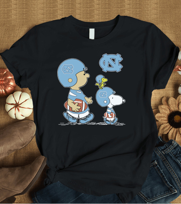 T-Shirt: North Carolina Tar Heels Peanuts Characters Charlie Brown Snoopy Football Helmets T-Shirt North Carolina Tar Heels Peanuts Characters Charlie Brown Snoopy Football Helmets T-Shirt