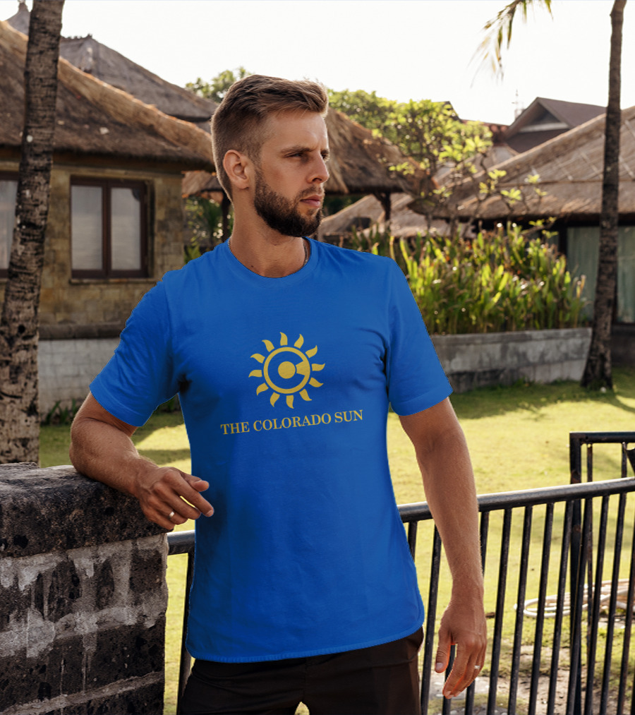 The Colorado Sun Merch Colorado Sun Logo Yellow Sunburst Blue Background T-Shirt