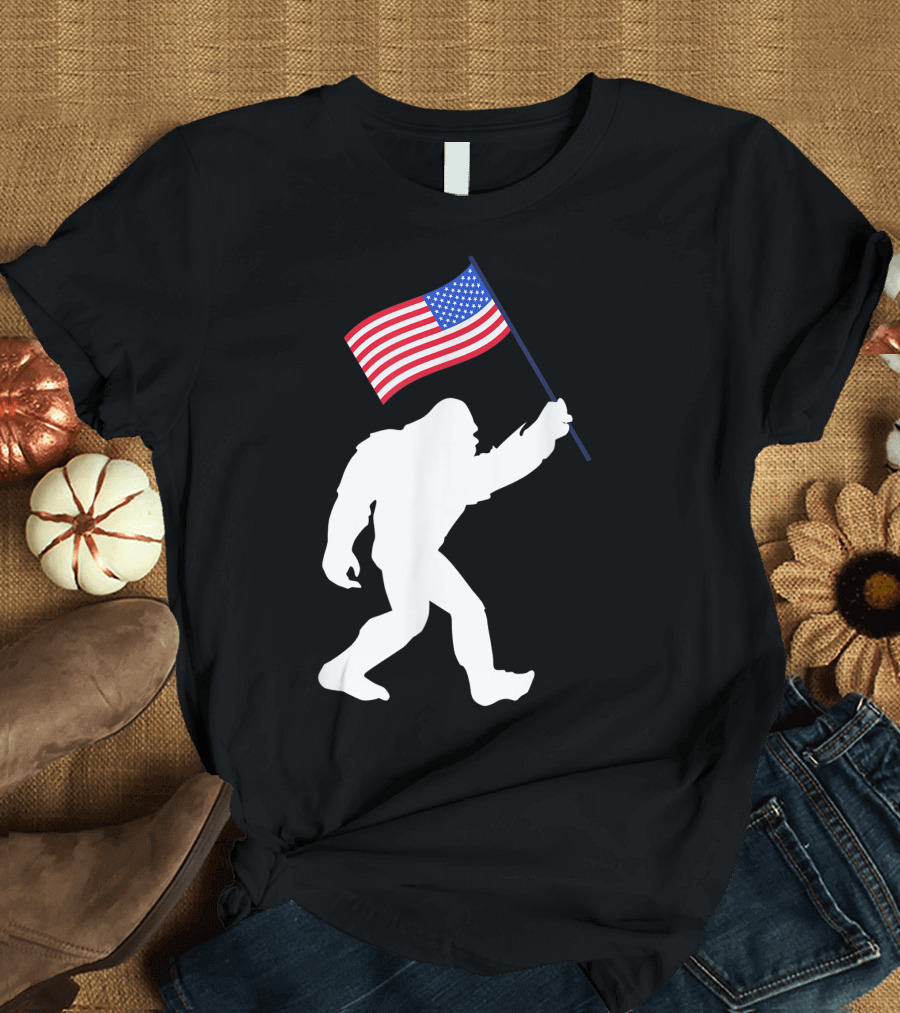 Bigfoot Carrying American Flag Patriotic 4th of July Humor T-Shirt