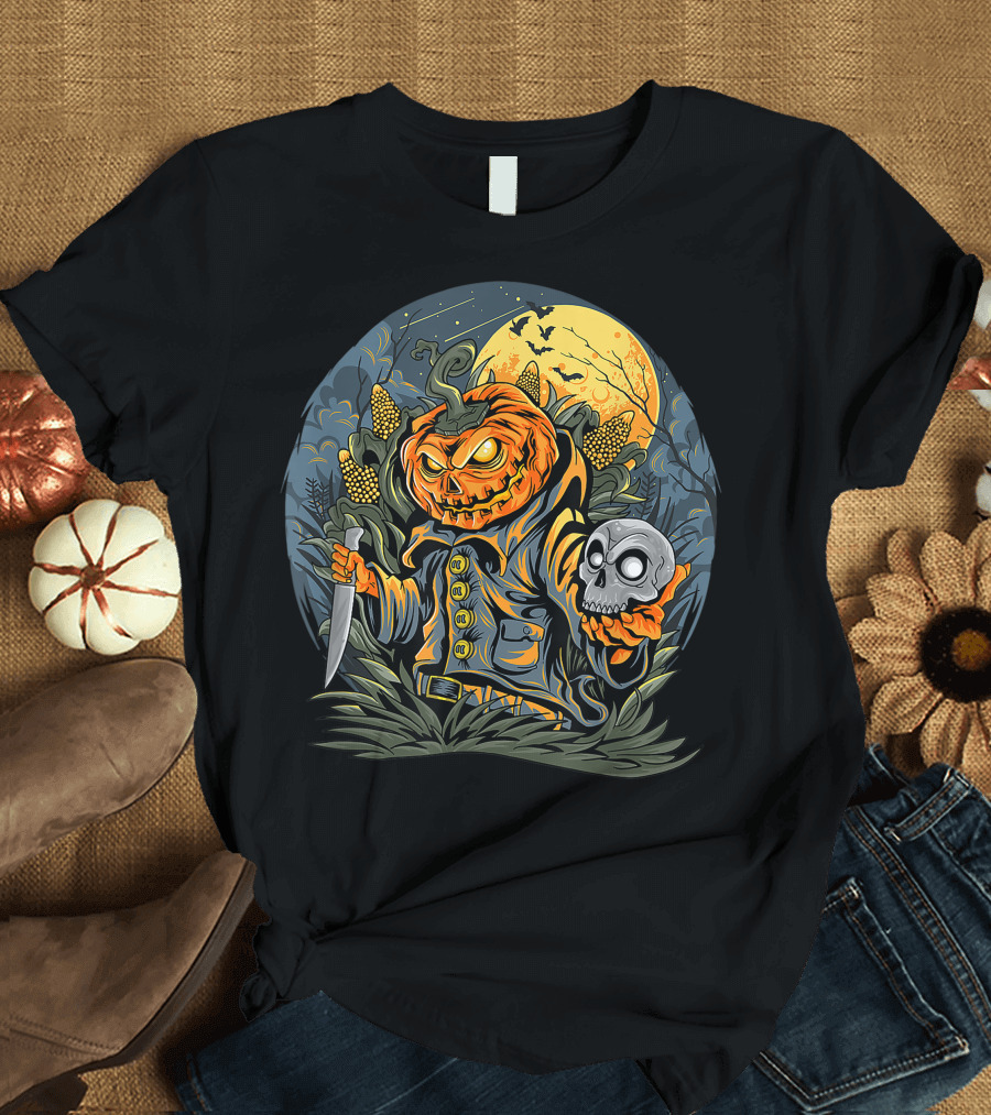 Pumpkin Man with Glowing Eyes Holds Skull and Knife in Cornfield Under Full Moon T-Shirt