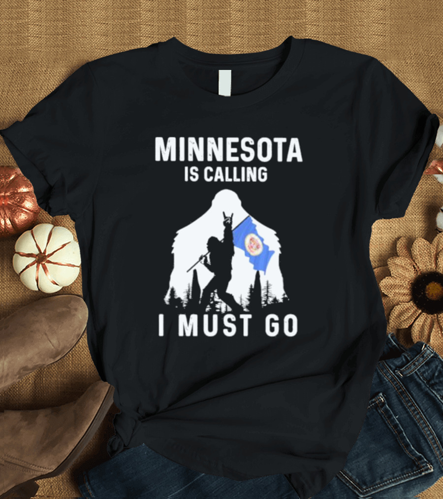 Minnesota Is Calling I Must Go Bigfoot Silhouette with Flag T-Shirt