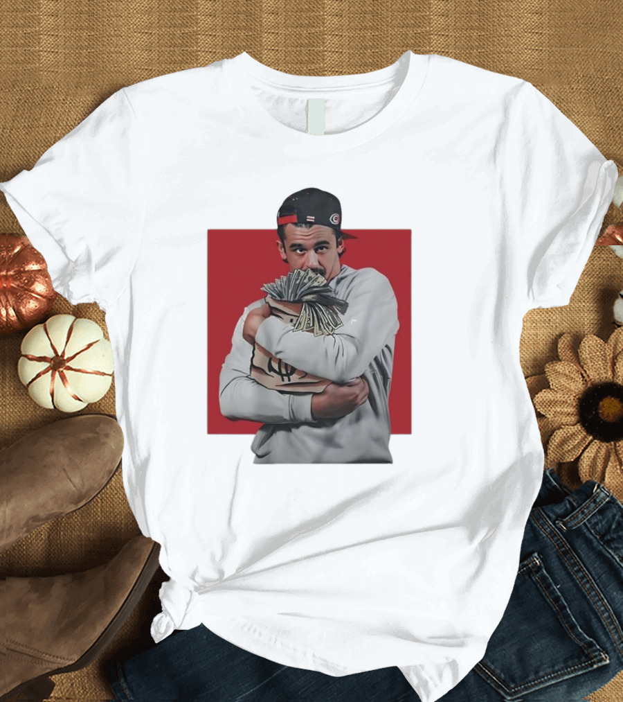 Seth Jarvis Holding Money Bag in Hockey Cap T-Shirt