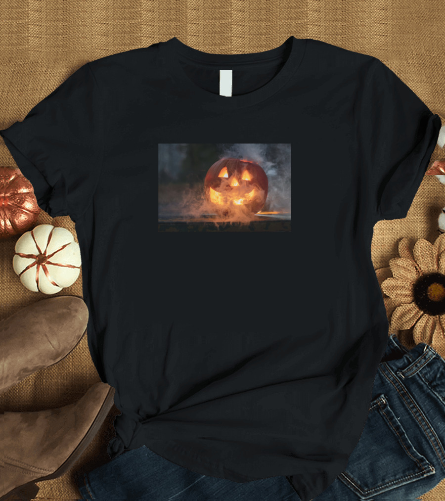 Haunted Pumpkin with Glowing Smile Amidst Misty Halloween Night T-Shirt