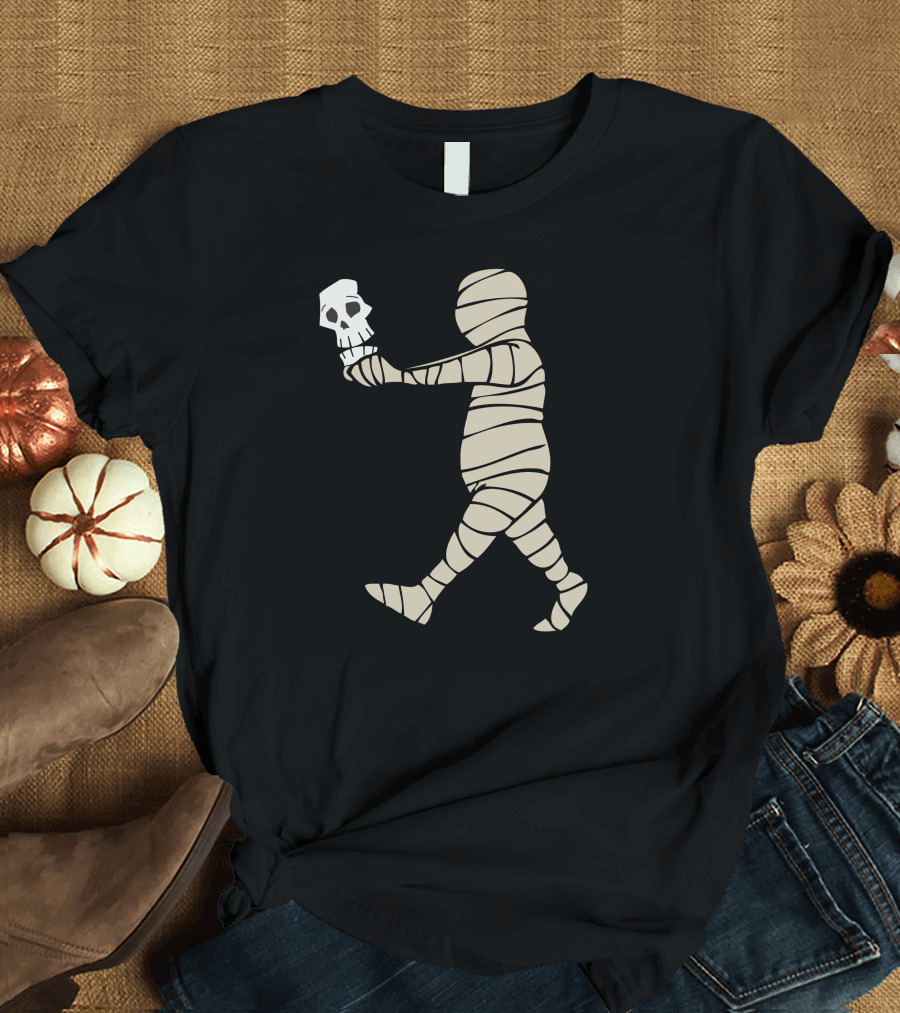 The Mummy Skull Walking with Wrapped Bandages and Skull in Hand T-Shirt