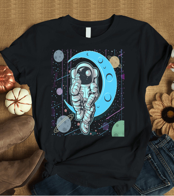 T-Shirt: Thoughtful Astronaut on Crescent Moon with Colorful Planets T-Shirt Thoughtful Astronaut on Crescent Moon with Colorful Planets T-Shirt