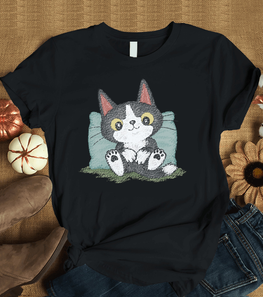 Black Kitten Relaxing on Blue Pillow with Green Background T-Shirt