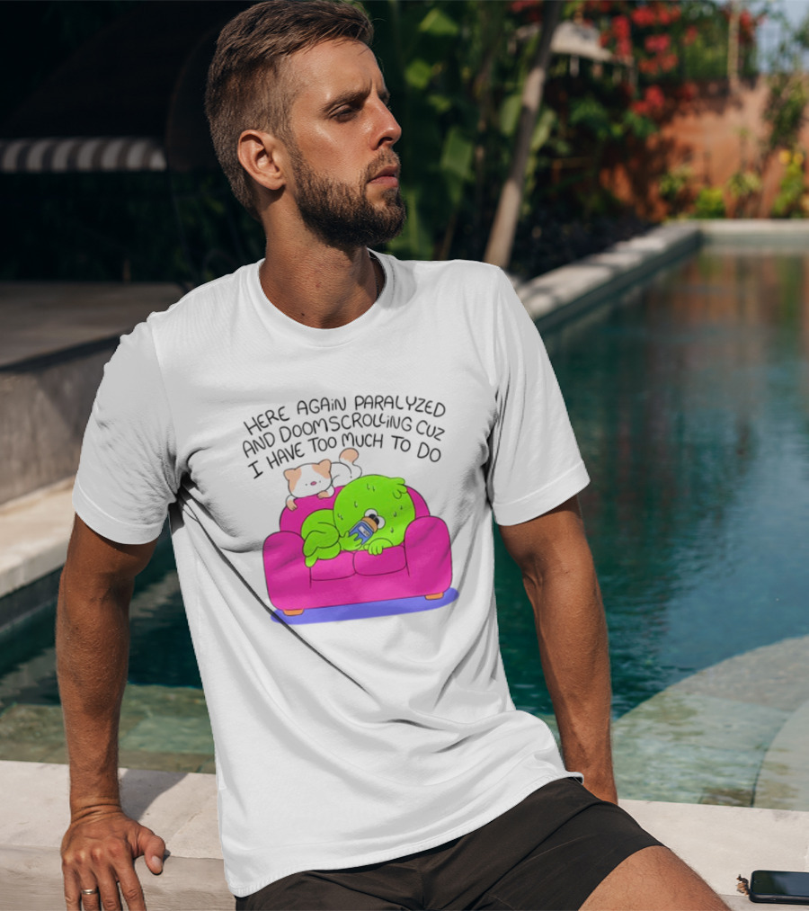 Here Again Paralyzed And Doomscrolling Cuz I Have Too Much To Do Quirky Green Figure Relaxing On Pink Couch With Cute Dog T-Shirt