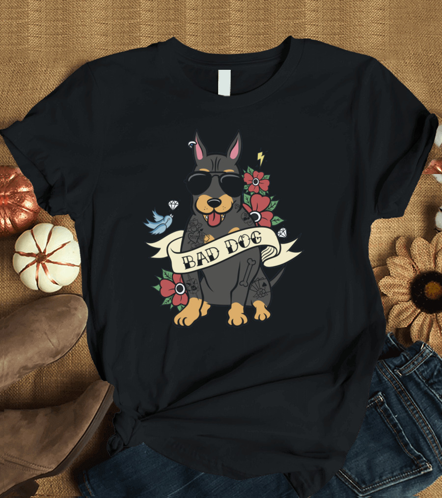 BAD DOG DOBERMAN WITH SUNGLASSES AND TATTOOS SURROUNDED BY FLOWERS AND BIRD ICONS T-Shirt