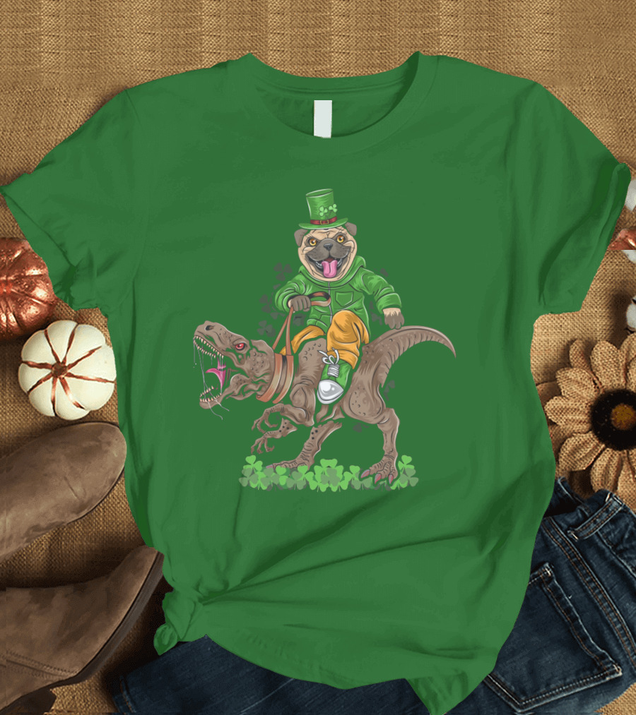 St Patricks Day Pug Puppy Riding Dinosaur Rex with Shamrocks and Leprechaun Hat T-Shirt
