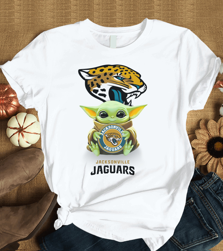 Grogu Holding Jacksonville Jaguars Badge with Mascot in Background T-Shirt