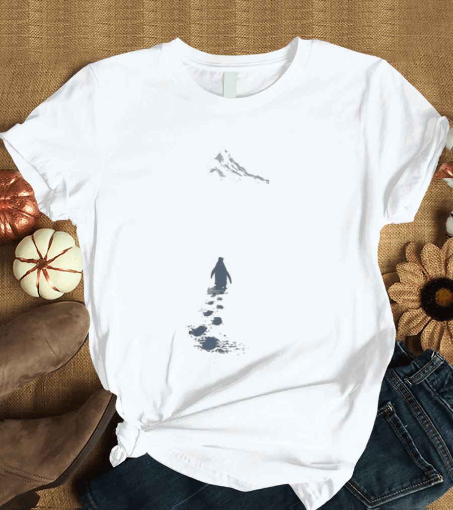 Nihilist Penguin Following Footprints Across White Snow T-Shirt