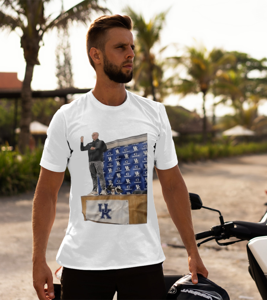 UK Volleyball Coach Craig Skinner Standing On Table With UK Logo And Awards T-Shirt