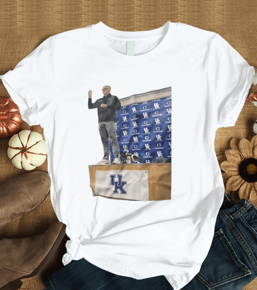 UK Volleyball Coach Craig Skinner Standing On Table With UK Logo And Awards T-Shirt