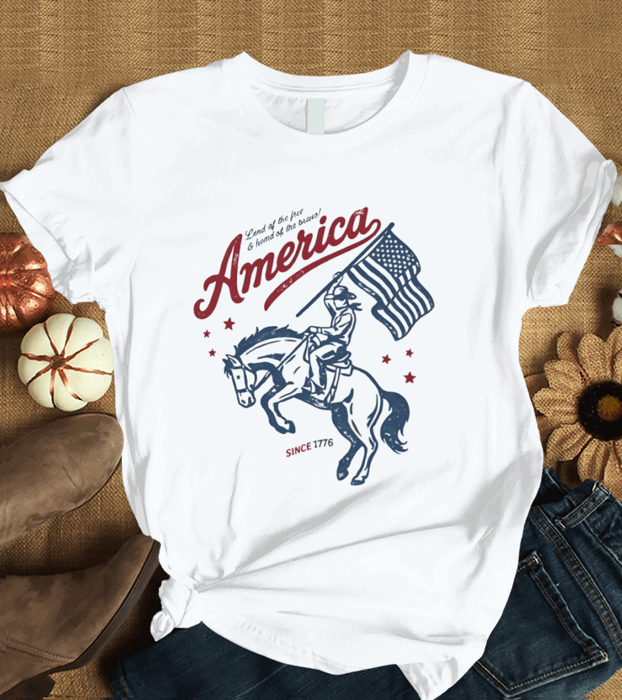 America Land Of The Free Home Of The Brave Since 1776 Cowboy Holding Flag Patriotic T-Shirt