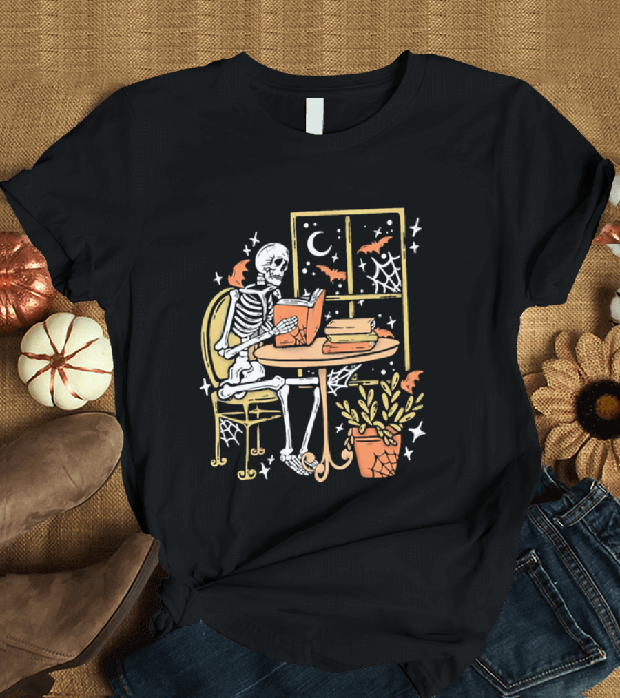 Cartoon Skeleton Reading Under Crescent Moon With Bats Orange Book Table Window T-Shirt