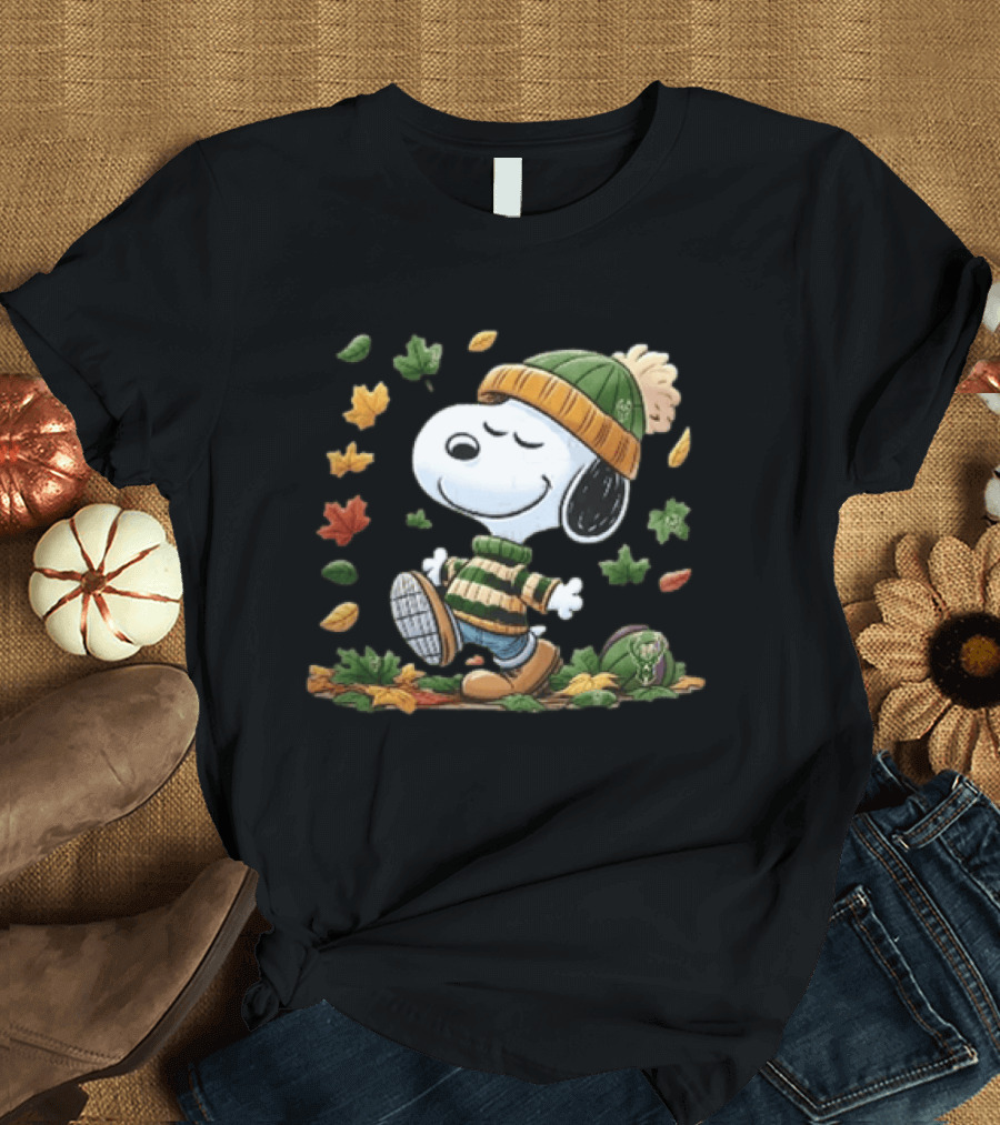 Milwaukee Bucks Snoopy In Beanie Walking Through Autumn Leaves Cartoon T-Shirt