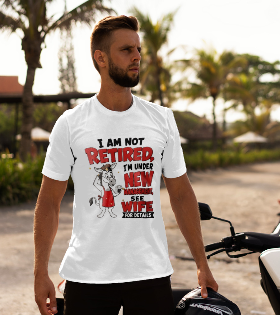 I Am Not Retired I'm Under New Management See Wife For Details Cartoon Donkey Red Apron T-Shirt