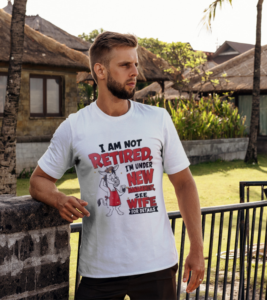 I Am Not Retired I'm Under New Management See Wife For Details Cartoon Donkey Red Apron T-Shirt
