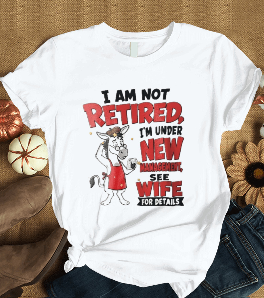 I Am Not Retired I'm Under New Management See Wife For Details Cartoon Donkey Red Apron T-Shirt
