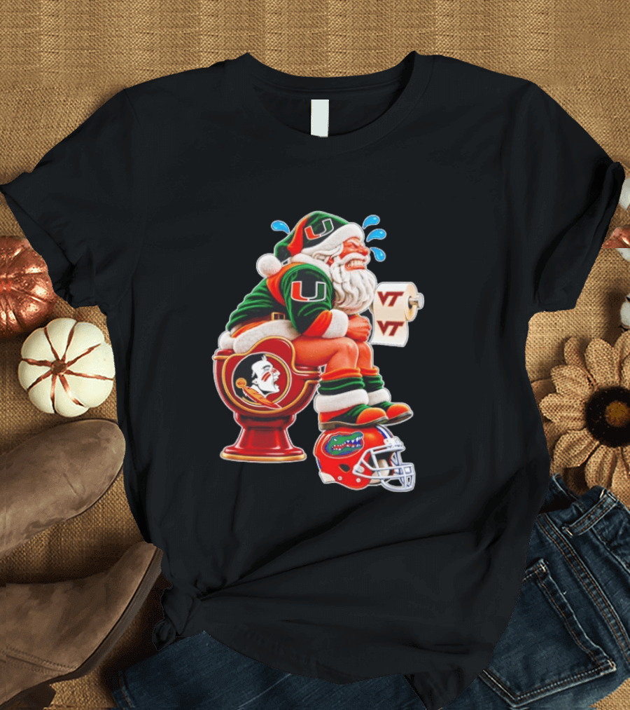 Miami Hurricanes Santa Claus Laughing On Florida State Toilet With Virginia Tech Toilet Paper And Florida Gators Helmet T-Shirt