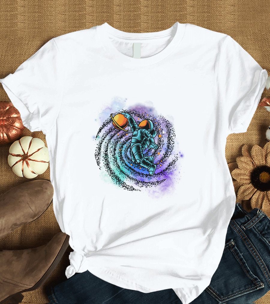 Astronaut Grasping Saturn in Cosmic Swirl 'Conquer the Universe' T-Shirt