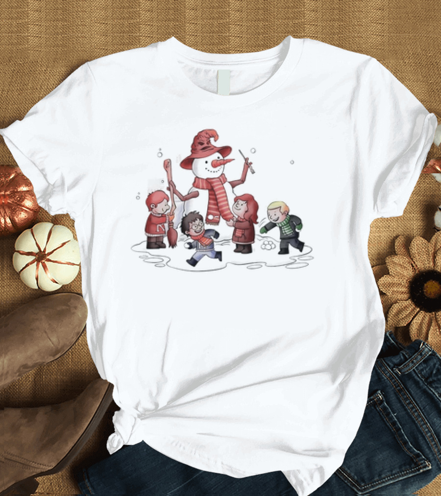 Young Wizarding Students Joyfully Crafting a Snowman with Scarves and Wand T-Shirt