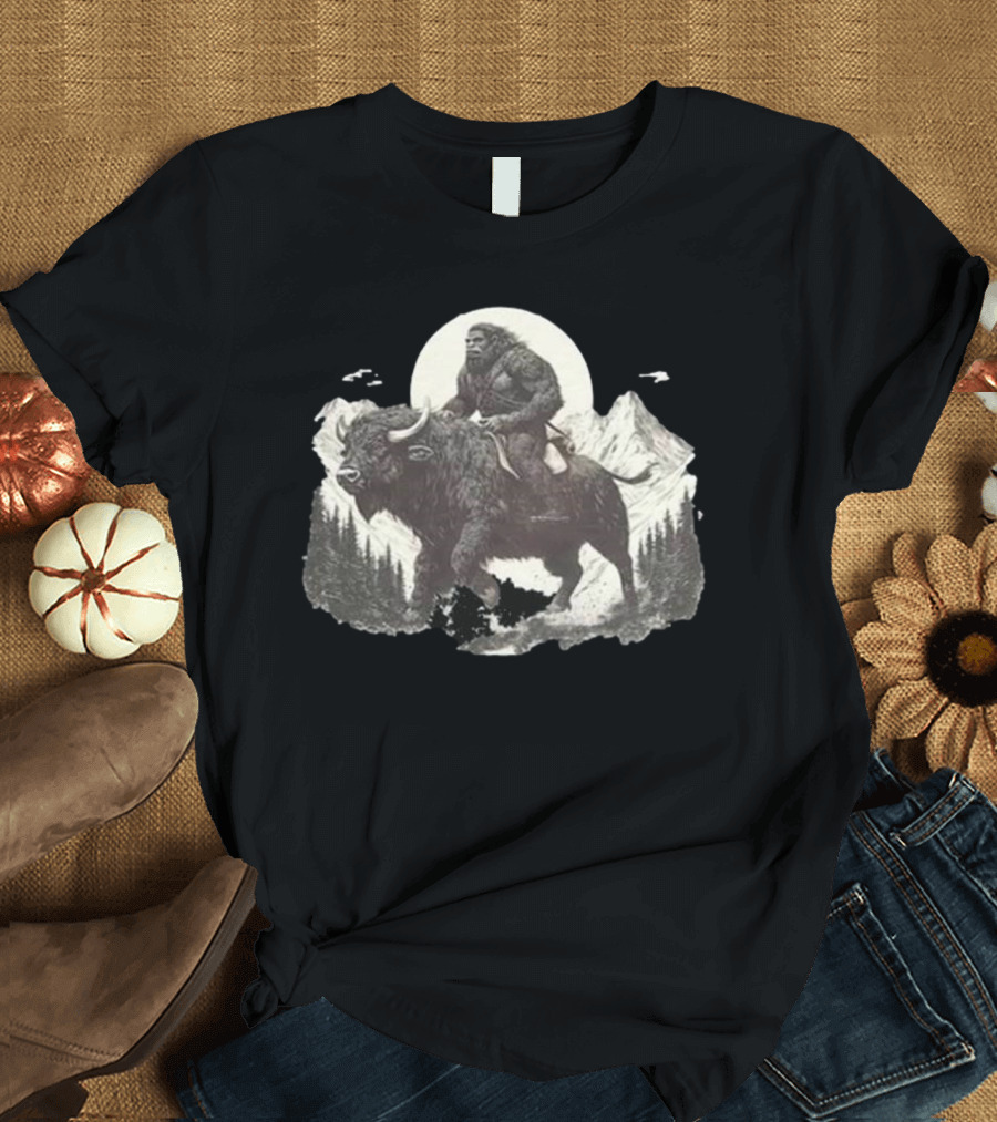 Blurry Creatures Bigfoot Riding Buffalo with Mountains and Moon in Background T-Shirt