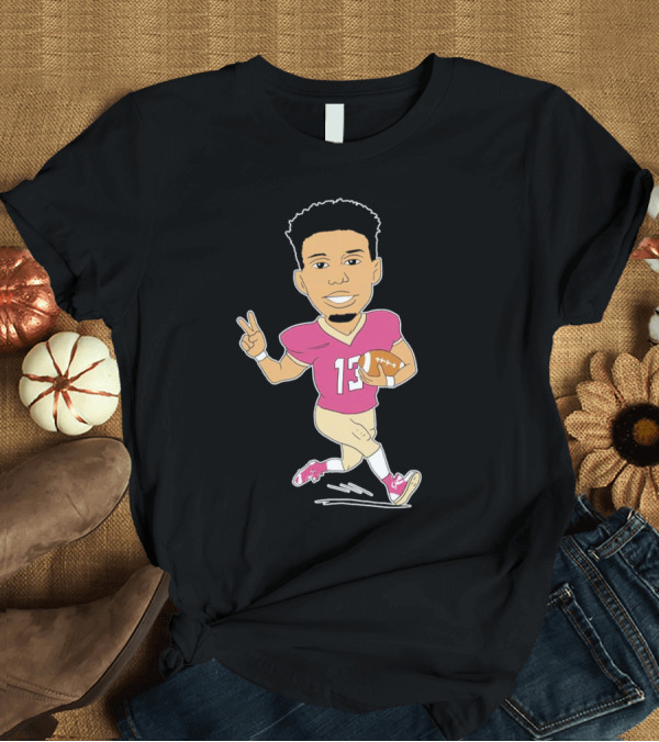 T-Shirt: Jordan Travis Cartoon Character Football Peace Sign T-Shirt Jordan Travis Cartoon Character Football Peace Sign T-Shirt