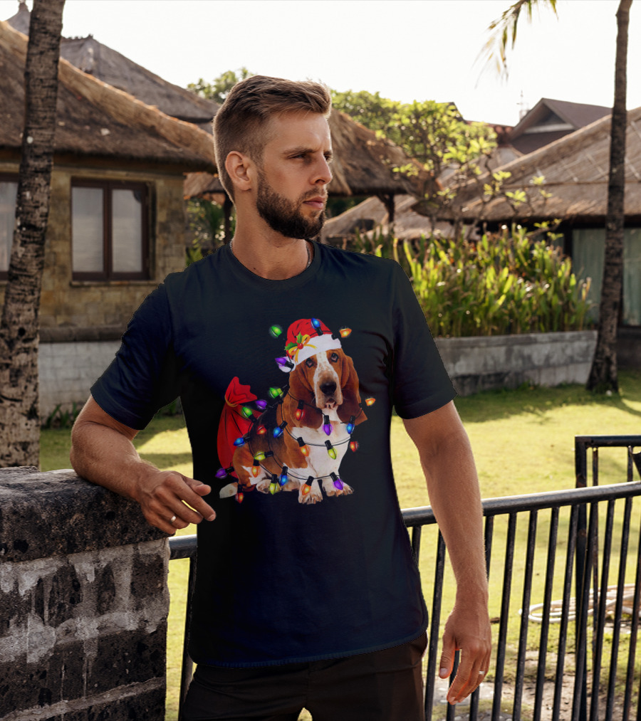 Basset Hound Wrapped In Christmas Lights With Santa Hat And Red Sack T-Shirt