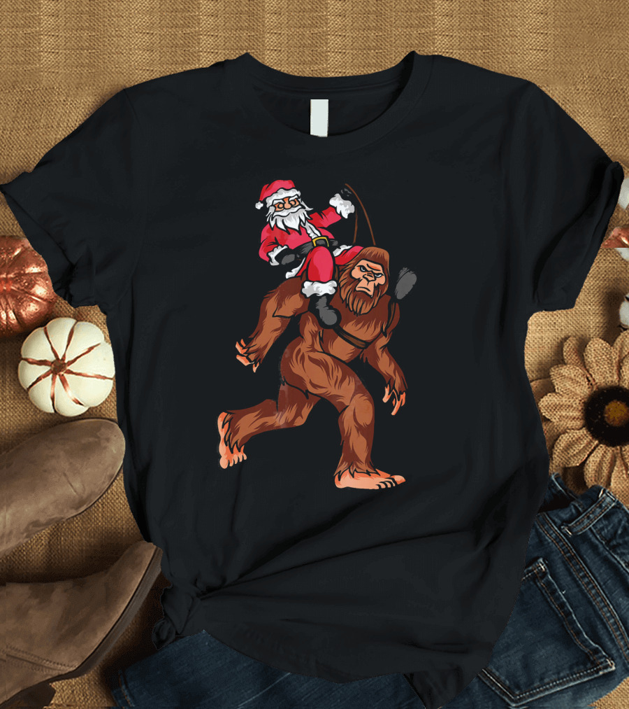 Bigfoot Carrying Santa Claus in Christmas T-Shirt